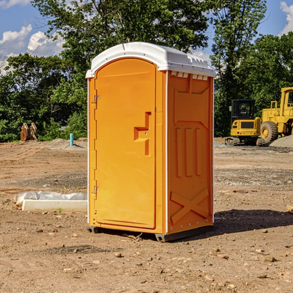 what is the cost difference between standard and deluxe portable restroom rentals in Spruce